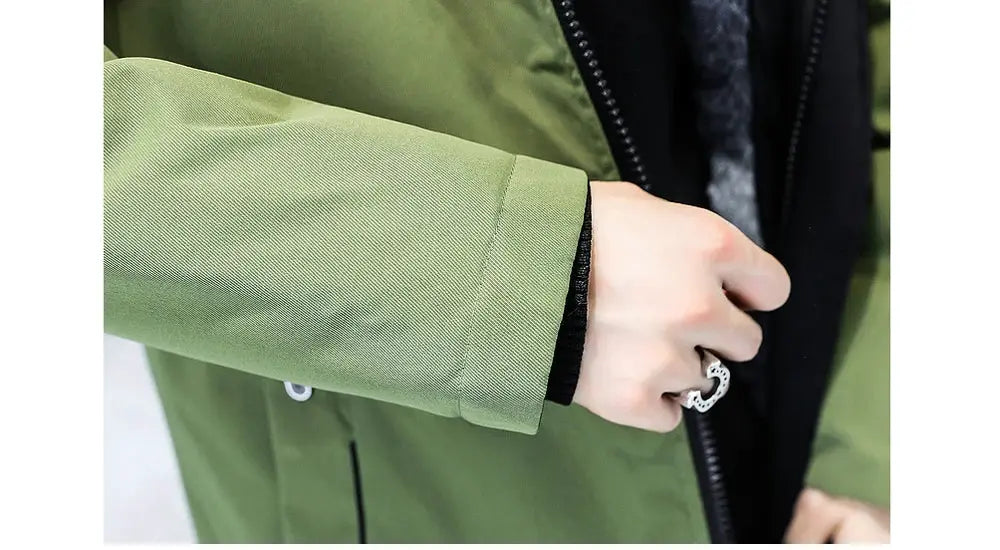 Men's green long down jacket sleeve closeup with black cuff and zipper