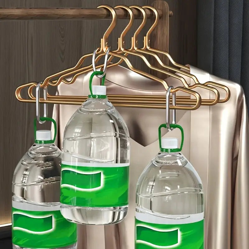 Golden aluminum alloy clothes hangers on a closet rod; durable wardrobe organizer set