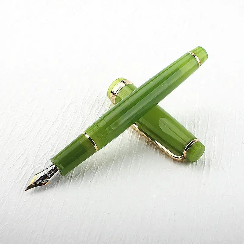 Jinhao 82 fountain pen, green acrylic with gold trim, converter included