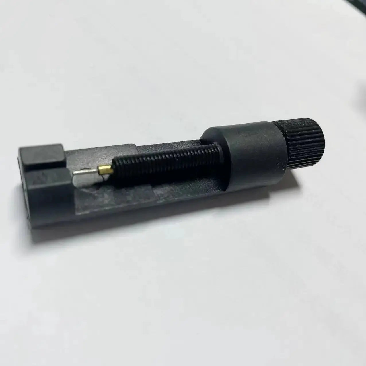 Watch band link pin remover tool, metal with black finish and adjustable screw
