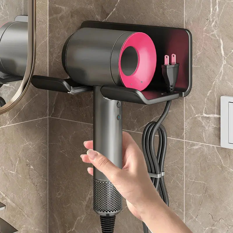 Simples Market hair dryer holder wall-mounted bathroom rack with gray body and pink cylindrical holder.