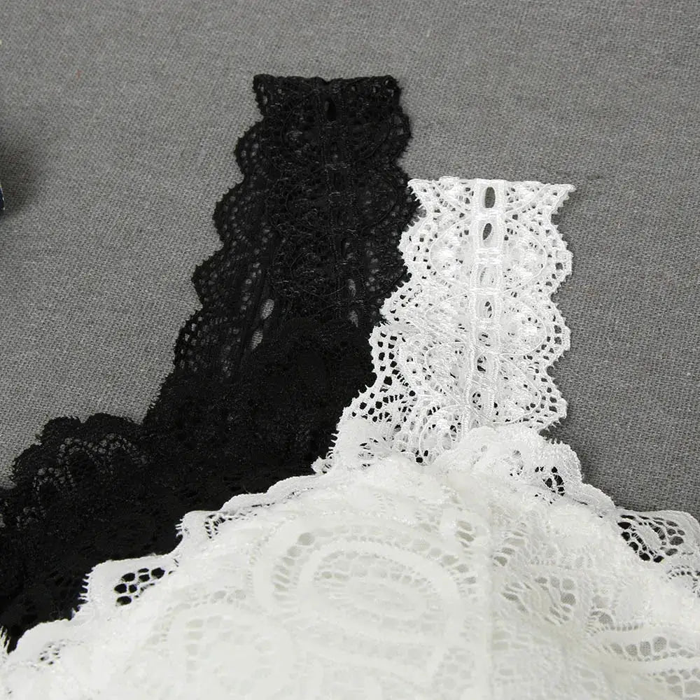 Two women's lace crochet tank tops in black and white with floral patterns