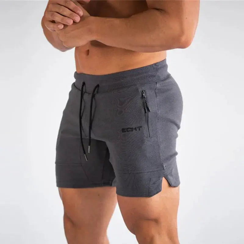 Men's gray gym shorts with zip pockets, drawstring waist, mid-thigh length