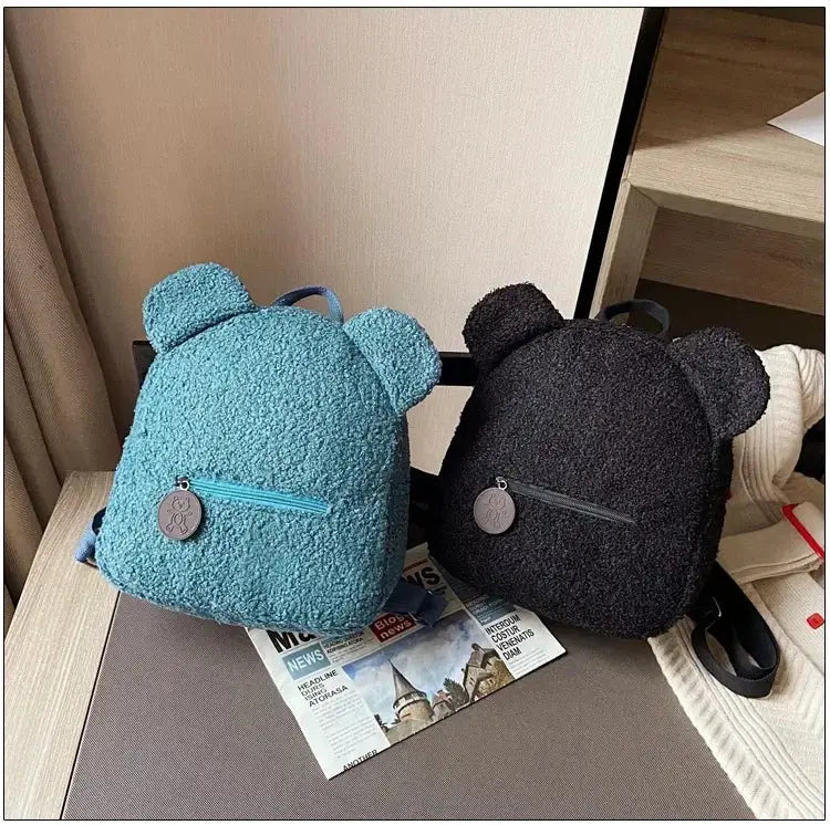 Bear-ear fleece mini backpacks for kids, blue and black, with front zip pockets; set of two
