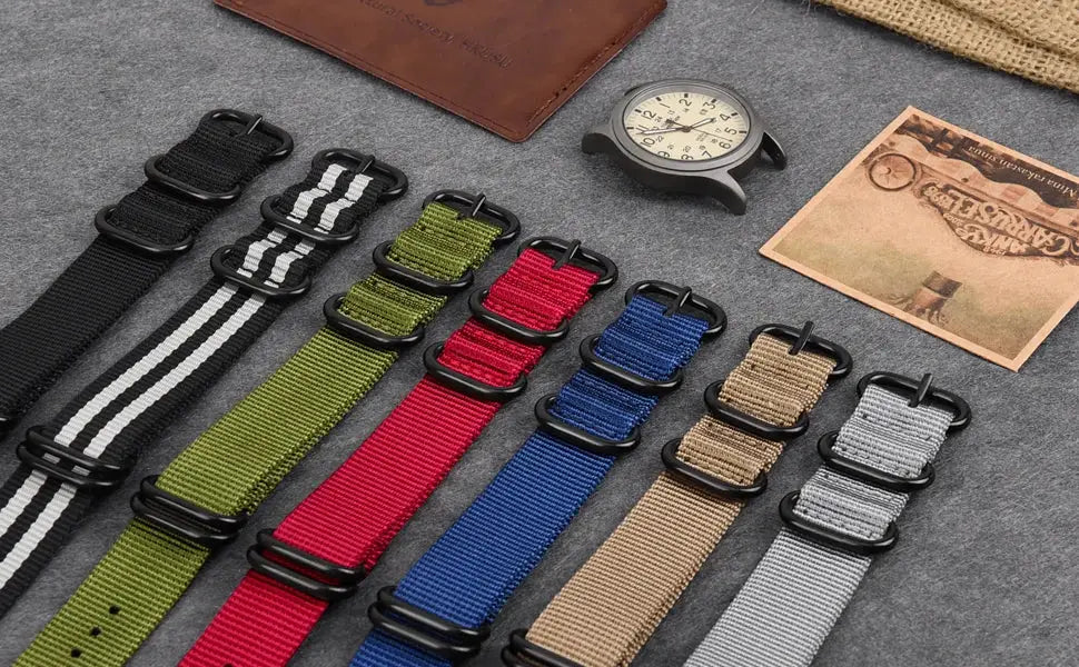 Simples Market 40mm field watch with fabric strap; quartz, luminous bezel, date and day, plus varied nylon NATO straps.