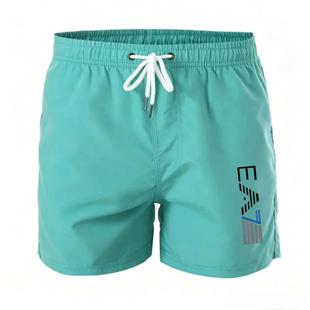 Men's teal swim trunks with drawstring, elastic waist and mesh lining