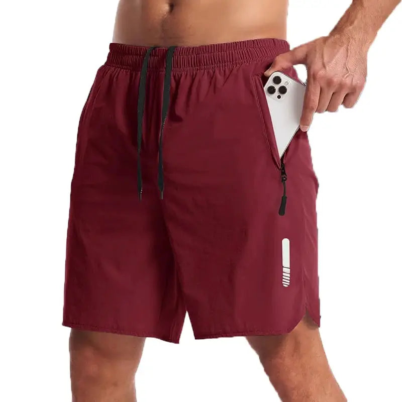Men's maroon sport shorts by Simples Market with zip phone pocket, black drawstring, lightweight nylon fabric