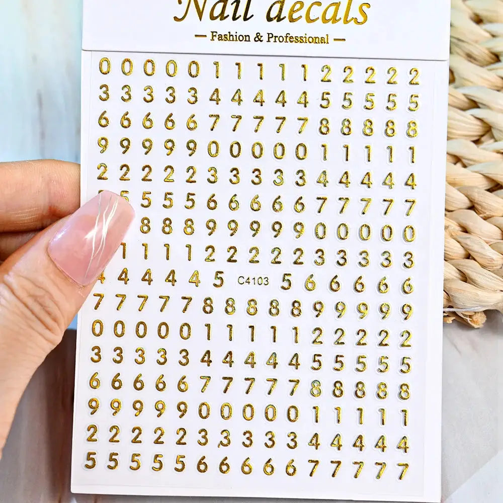 Simples Market gold numeric nail decals sheet with digits 0 to 9 for manicures.