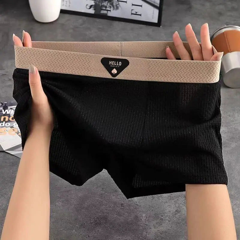 Men's boxer shorts, black ribbed fabric with beige elastic waistband featuring Hello logo