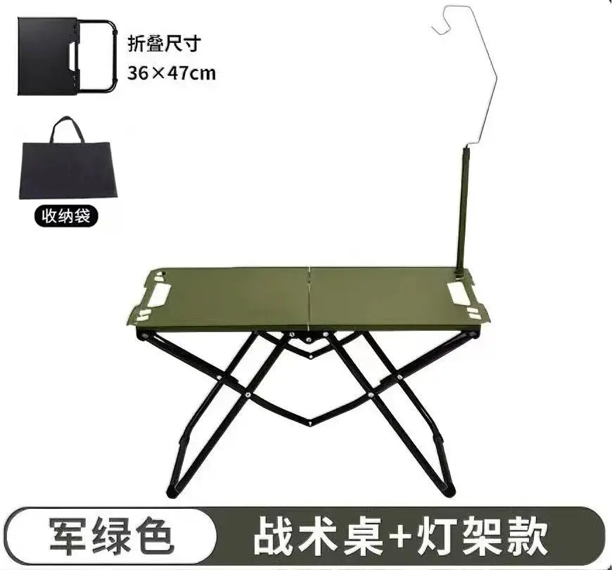 Portable folding camping table in army green with stainless steel frame; compact for camping and beach use