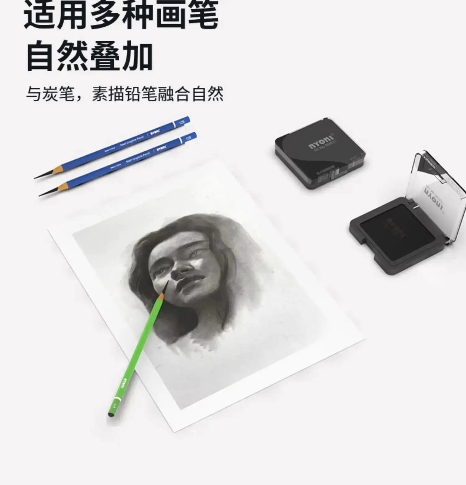 Professional ultra-soft artist drawing set with blue pencils, charcoal pad, and a grayscale portrait.