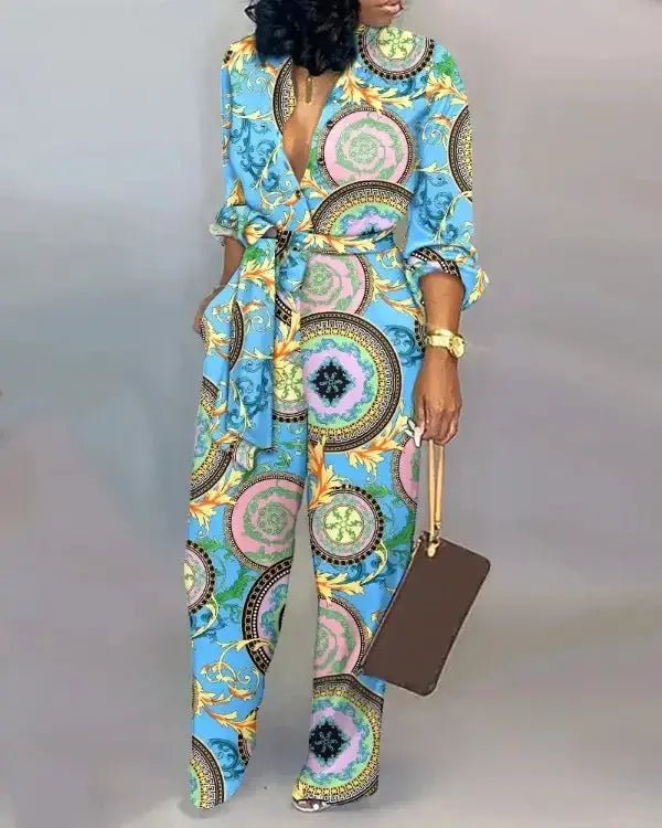 Women's blue letter-print long-sleeve jumpsuit with waist belt; full-length with ornamental circular print.