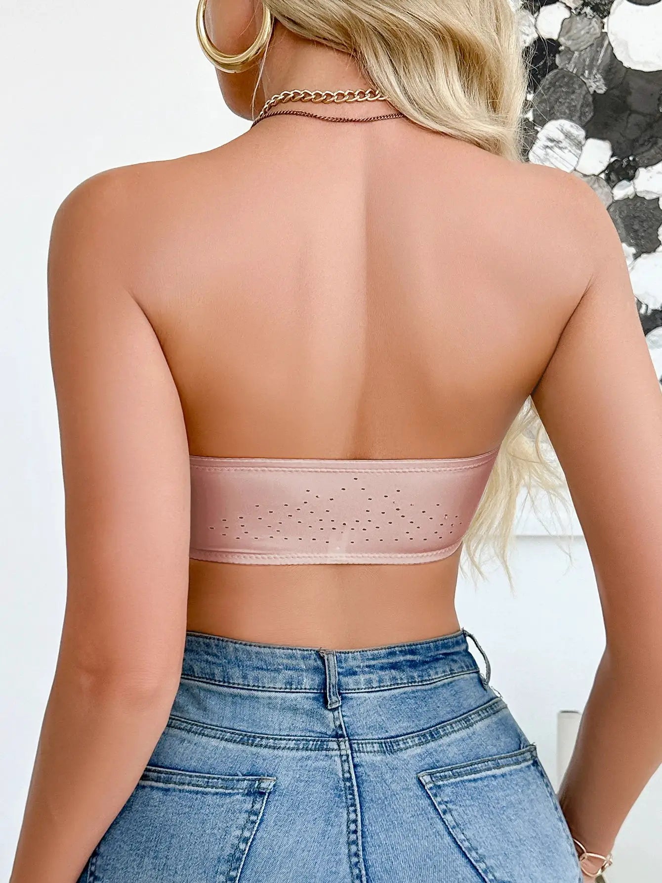 Blush pink strapless wireless bralette with perforated band detail back view