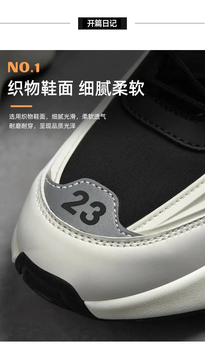 Men's sneakers, black upper with white sole and grey toe patch numbered 23