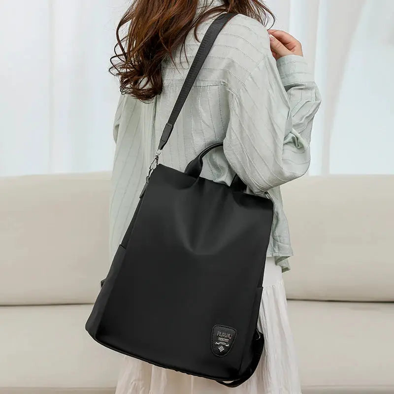 Women's anti-theft backpack by Simples Market, black large-capacity travel bag with adjustable strap.