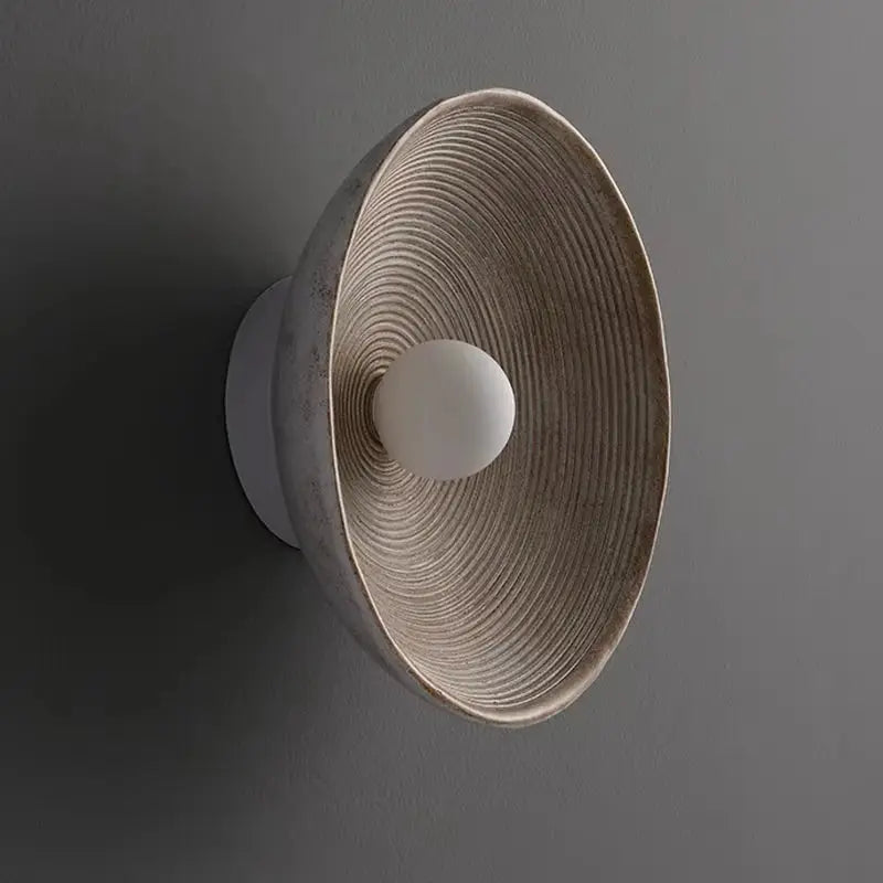 Retro Japanese resin wall lamp with ribbed circular shade and white bulb, wall-mounted