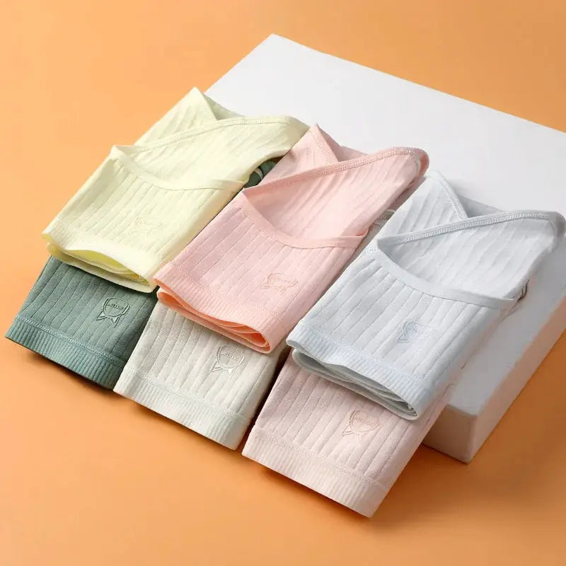 Women's cotton high-waist panties set; six pastel solid-color briefs in yellow, peach, green, blue, cream, pink