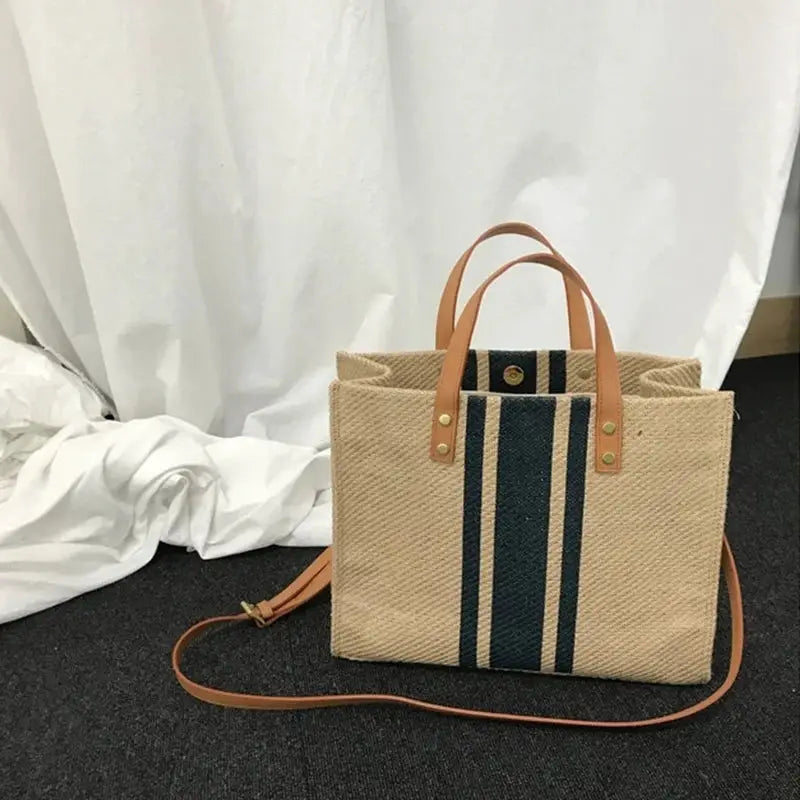 Canvas stripe tote bag with top handles and crossbody strap, beige with navy stripes