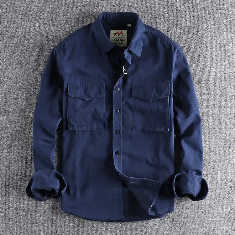 Simples Market navy blue work shirt jacket with two chest pockets, button front, rolled sleeves.