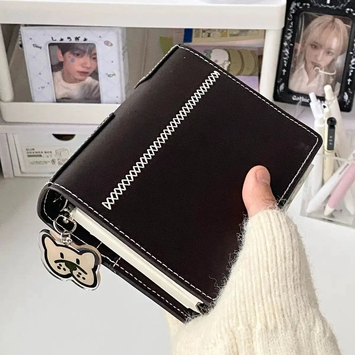 A7 binder notebook by Simples Market in dark brown faux leather with white stitching and 80 pages