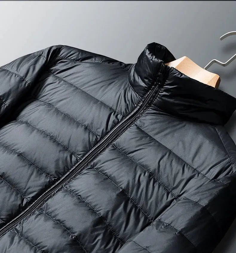 Plus-size men's hooded down jacket, lightweight dark gray puffer with front zipper.