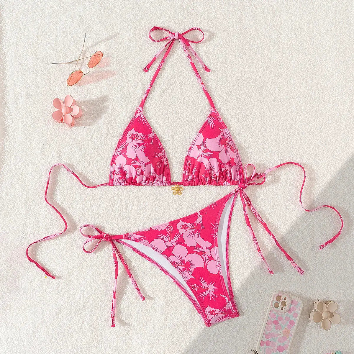 Women's two-piece pink tropical floral bikini set with adjustable tie sides