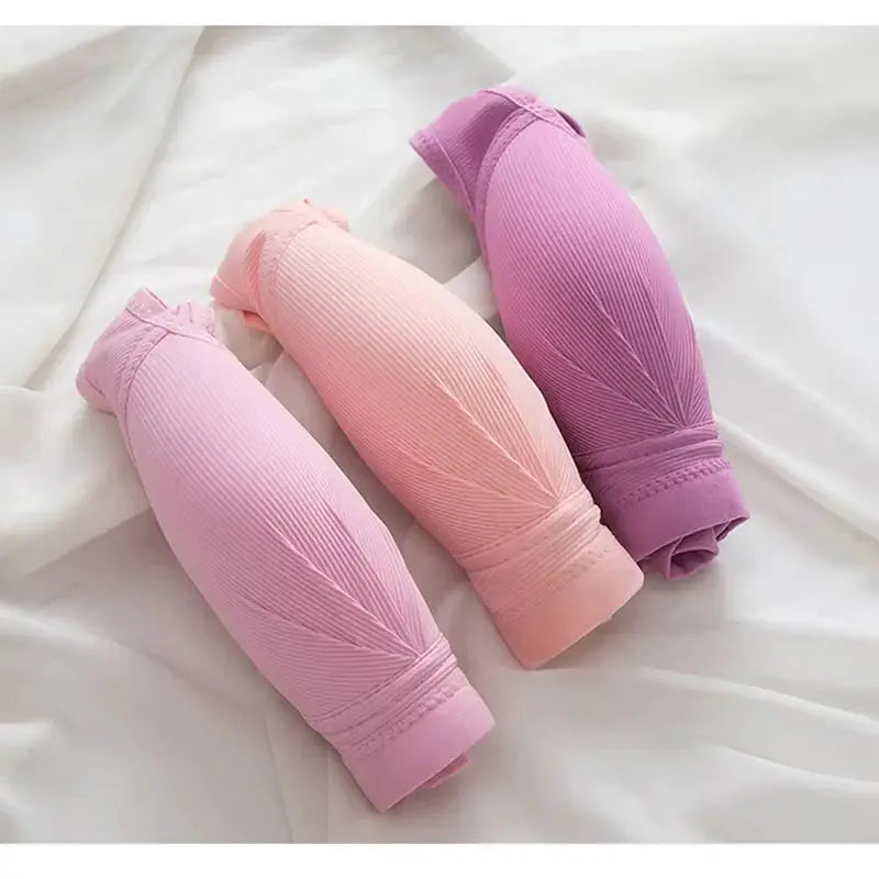 Push Up Front Button Bra trio in lavender, peach, and pink with ribbed fabric