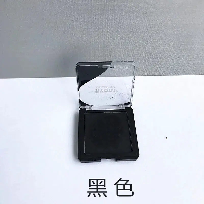 Charcoal drawing compact in black with clear lid; blendable pigment for sketching