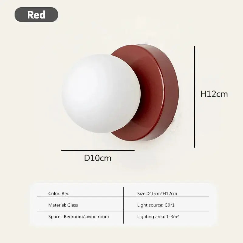 Nordic macaron LED wall lamp in red, glass sphere on a red circular backplate, 10cm diameter and 12cm height