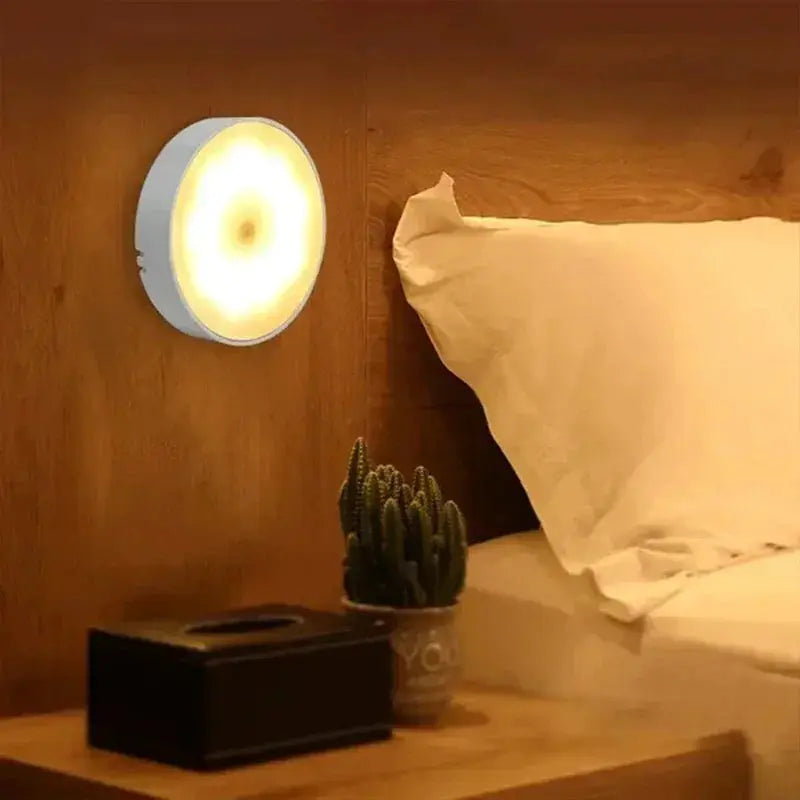 Simples Market motion sensor night light, USB rechargeable round warm-LED wall lamp mounted beside bed on wood wall