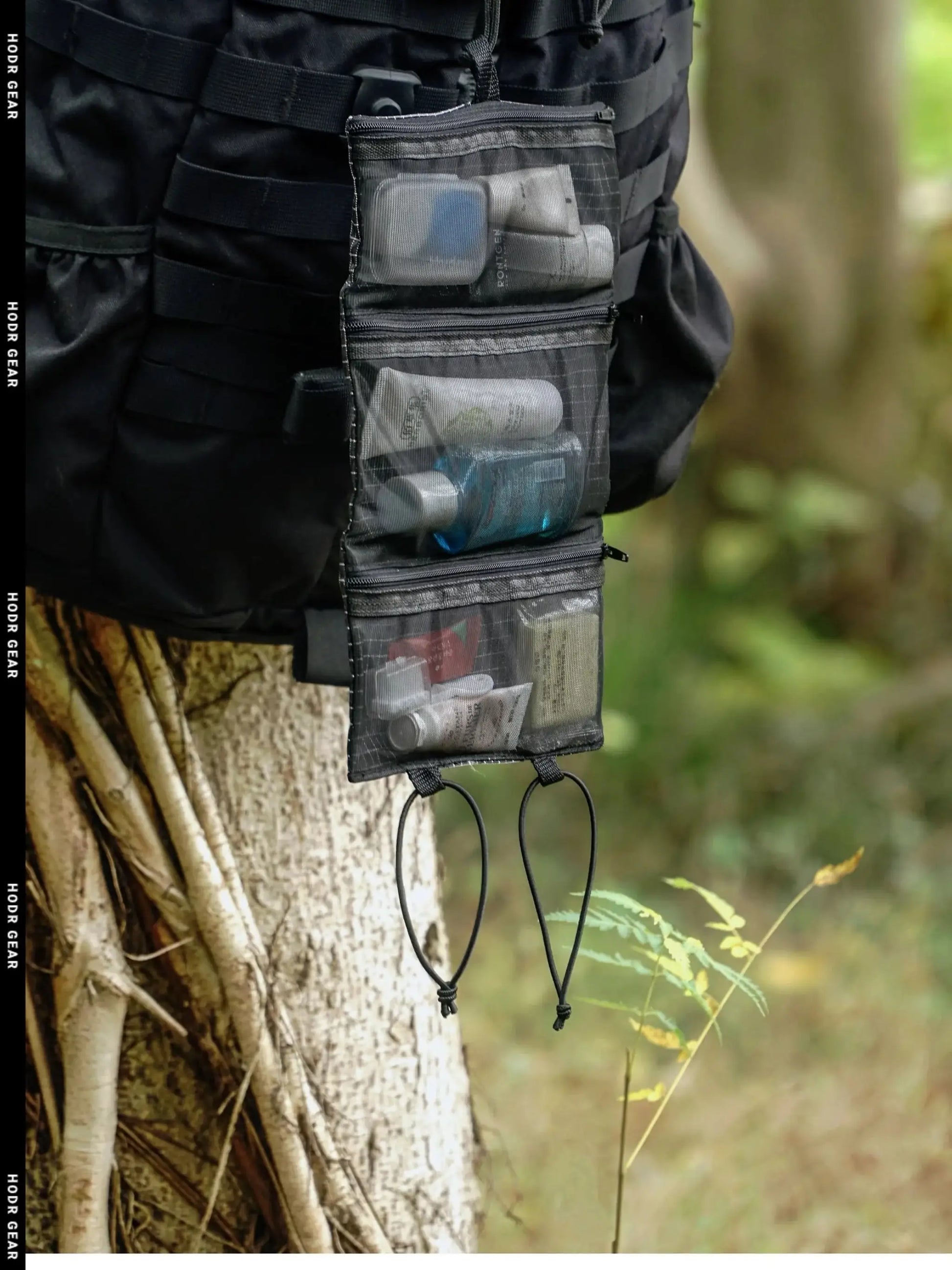 HODRGEAR Ultralight Toiletries Organizer on a hiking pack; roll-up mesh pouch with clear pockets.