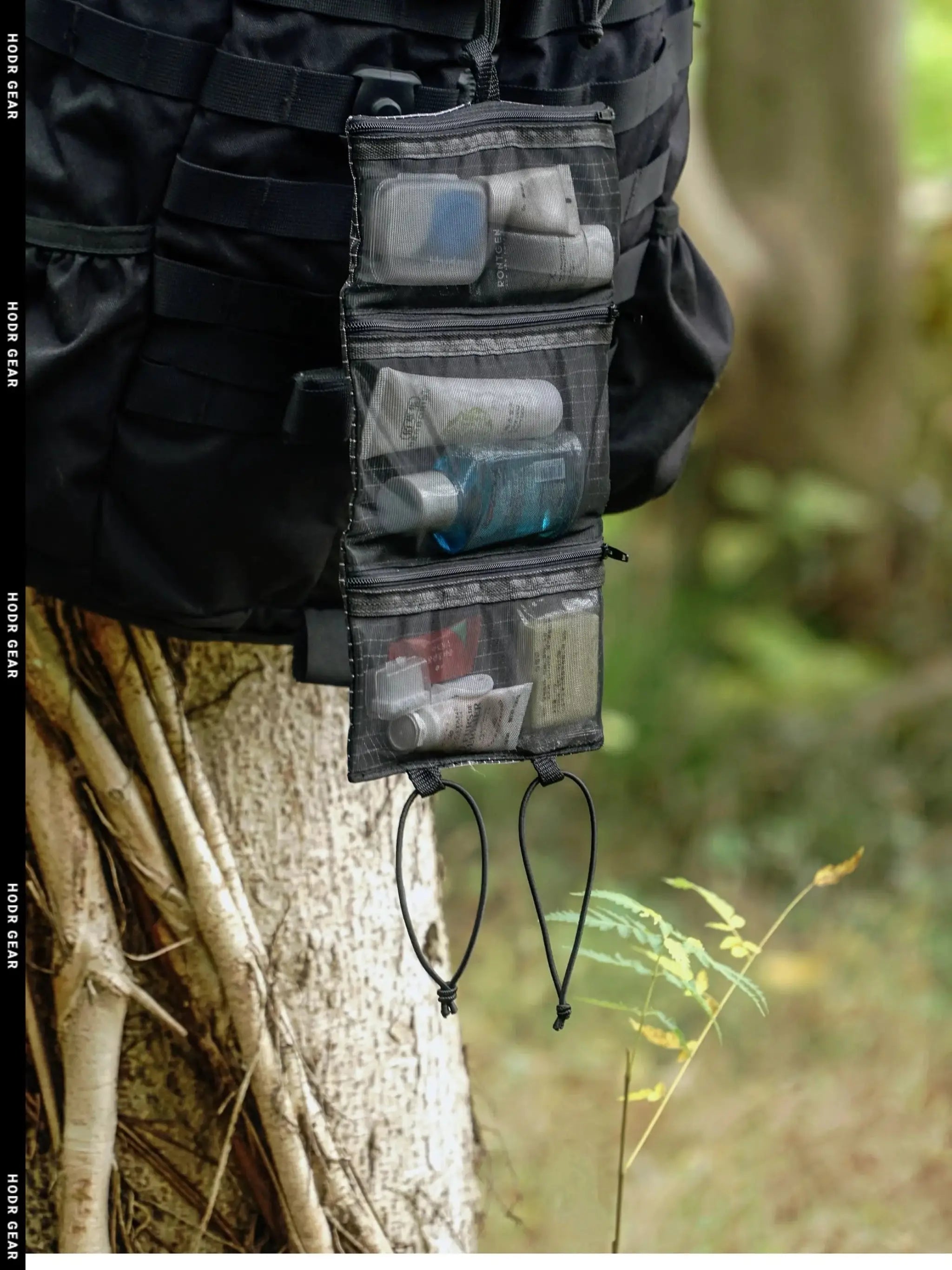 HODRGEAR Ultralight Toiletries Organizer on a hiking pack; roll-up mesh pouch with clear pockets.