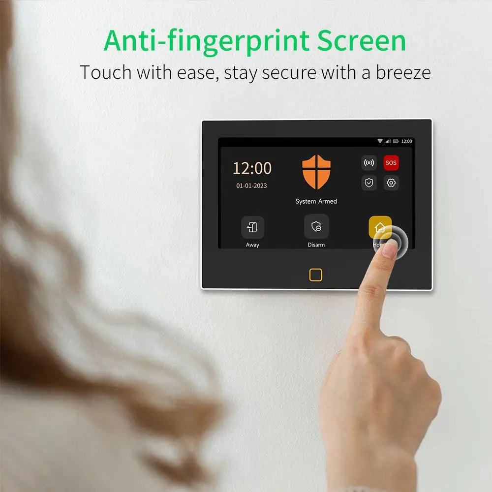 Staniot 7-inch touchscreen home alarm panel; wall-mounted black security device with on-screen icons