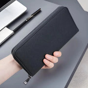 Men's long zippered wallet in black canvas with large capacity and multiple card slots.