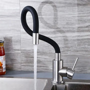 Deck-mounted kitchen faucet with black flexible hose and stainless steel body, hot and cold water mixer.