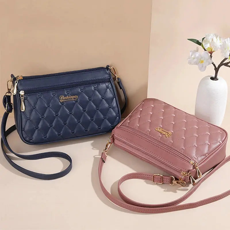 PU leather crossbody bags by Simples Market; two navy blue and pink quilted bags with gold hardware.