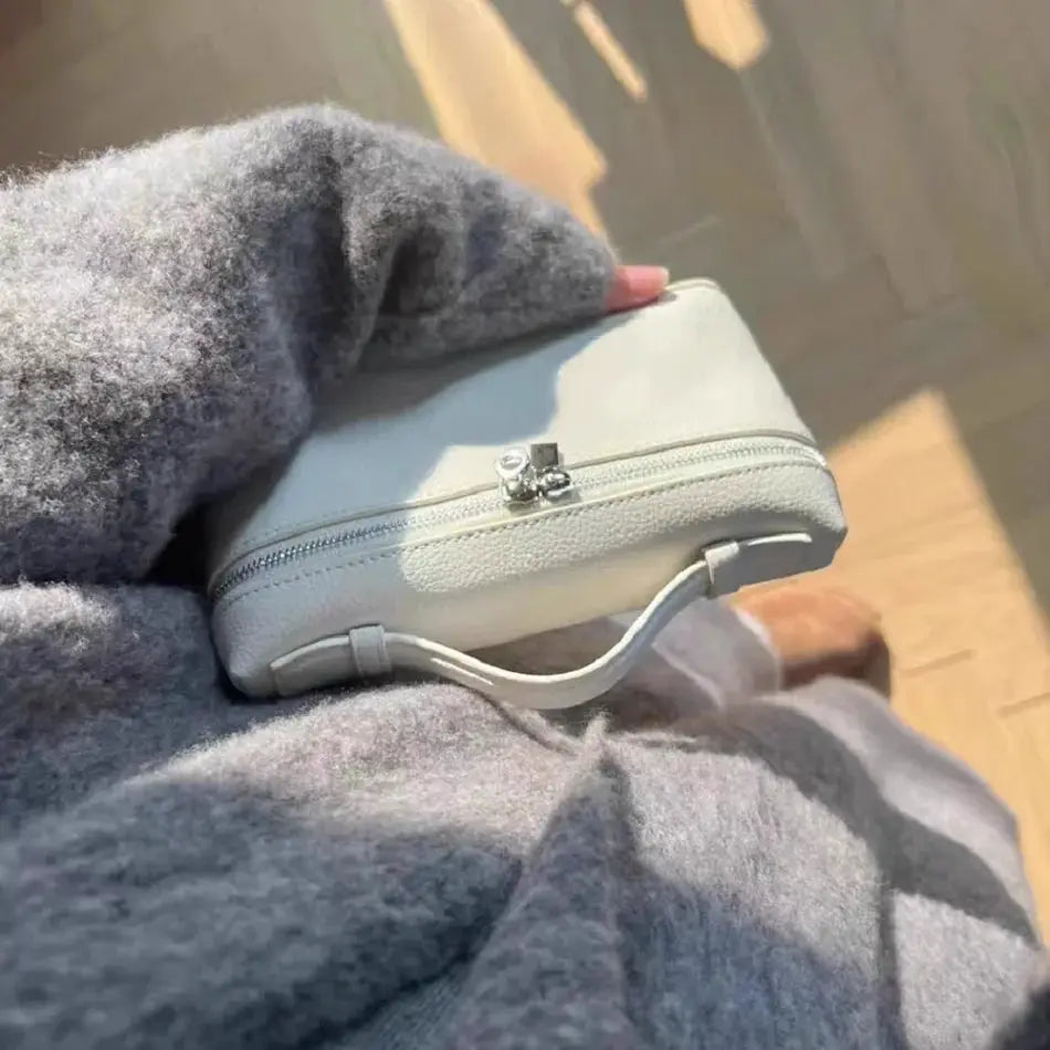 Lunch-box style mini shoulder bag in white lychee-grain texture with wrist strap