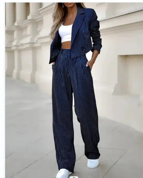 Women's navy pinstripe blazer and straight pants suit set by Simples Market