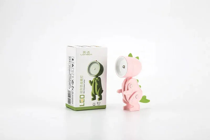 Pink mini LED night light cartoon hero police desk lamp from Simples Market beside its box
