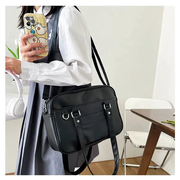 Simples Market Japanese Style JK bag for women, black PU leather shoulder crossbody with front buckle straps