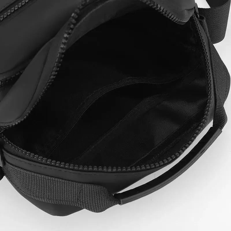 Messenger sling bag in black Oxford fabric with zipper, compact crossbody pouch