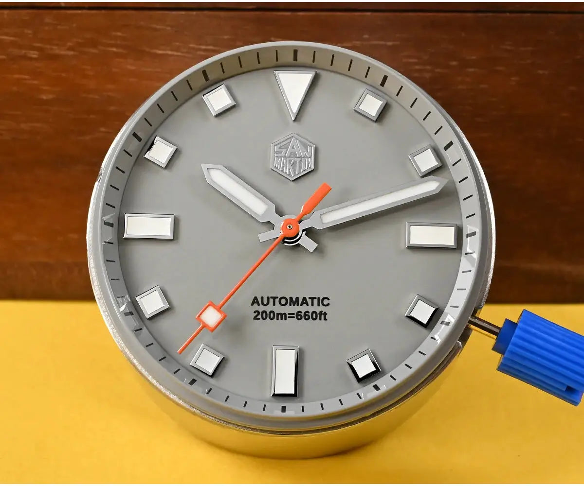 San Martin diver watch dial; gray face with luminous markers and orange seconds hand, 200m water resistance