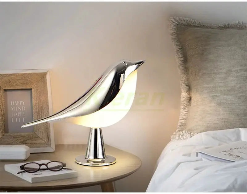 Nordic Magpie LED desk lamp, metallic silver bird design