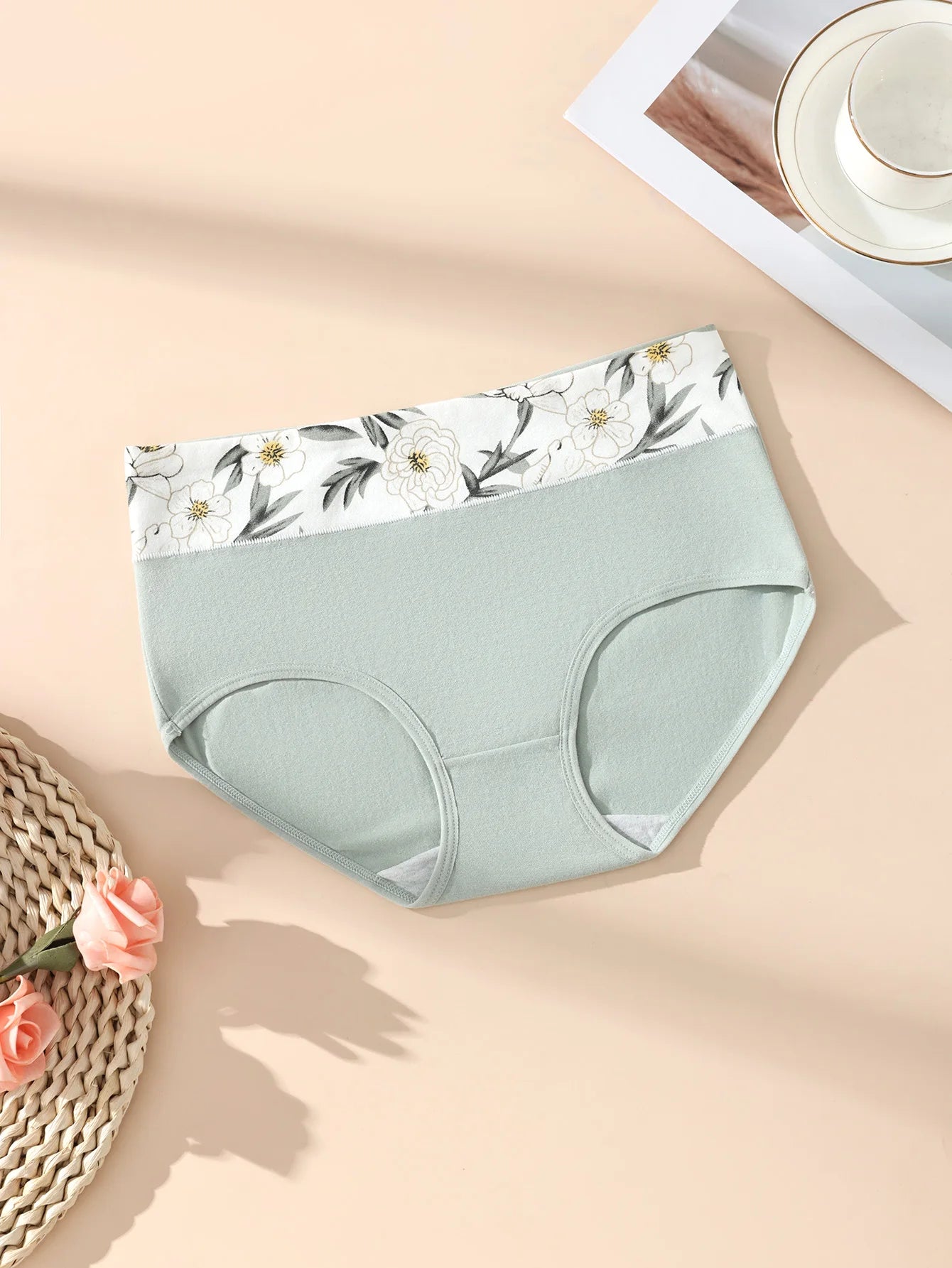 Women's high-waist cotton briefs in mint green with floral waistband, breathable underwear