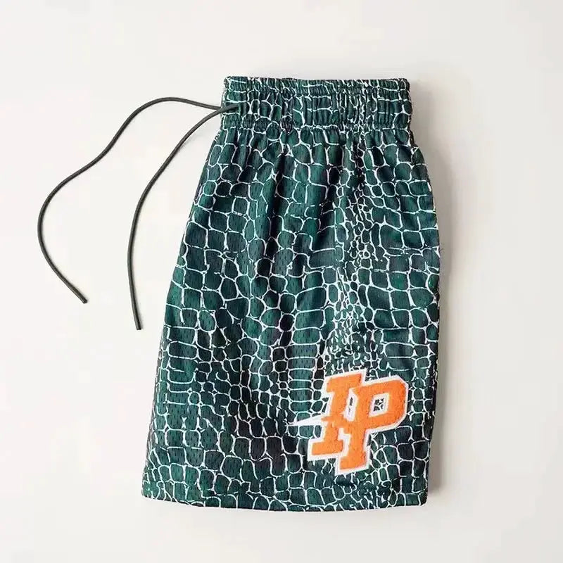 Men's shorts with green reptile-pattern fabric, quick-dry breathable mesh, drawstring waist, orange logo patch