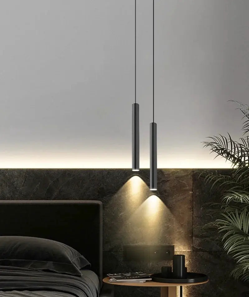Simples Market minimalist bedside pendant lamp duo, black cylindrical metal with LED bottom glow.