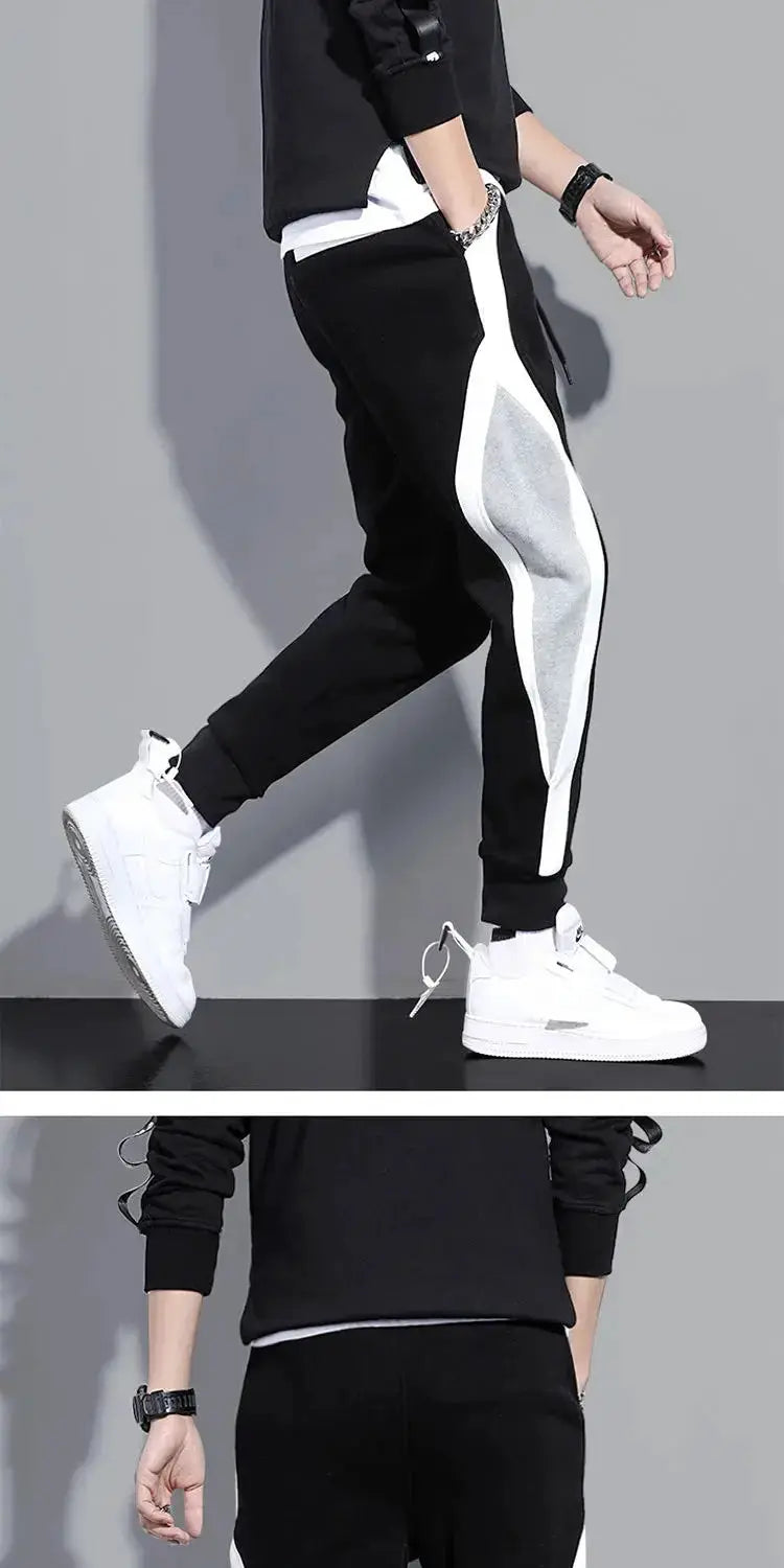 Simples Market autumn men's wide loose casual patchwork track pants, black with white side panels and elastic cuffs.