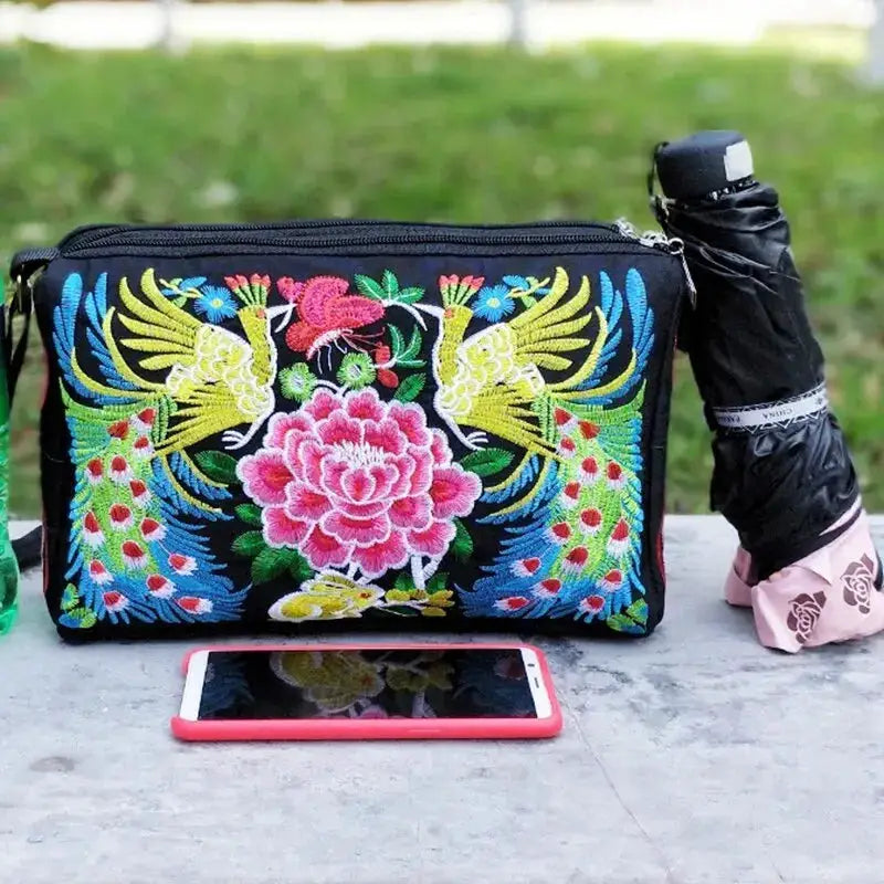 Women's embroidered nylon crossbody bag with vibrant floral and peacock embroidery; large capacity travel bag