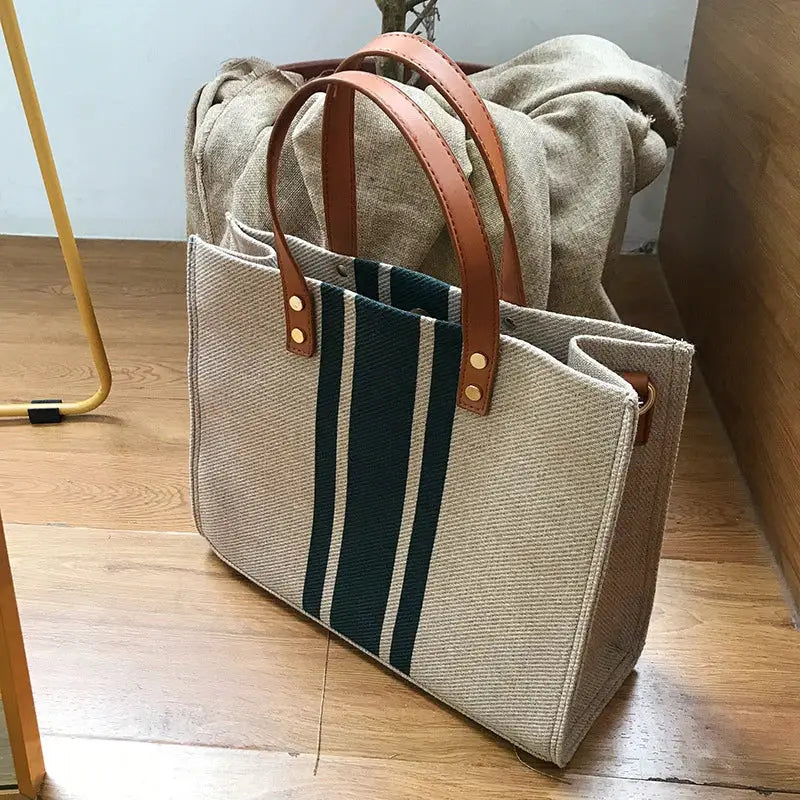 Canvas stripe bucket handbag by Simples; beige with dark green stripe and brown leather top handles, large capacity tote
