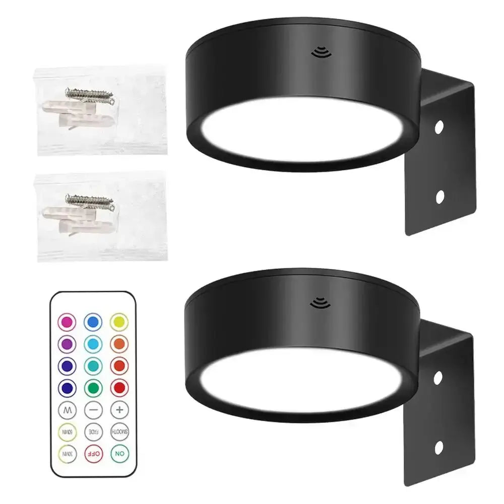 LED wall picture lights by Simples Market, 13-color RGB, battery-powered, two black circular lights with remote.